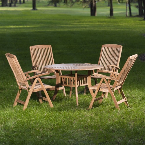 70045 Hyatt Recliner 5 piece round teak Dining Set of 4 teak reclining armchairs and a round 48 inch diameter dining table with optional teak lazy susan angled on white background