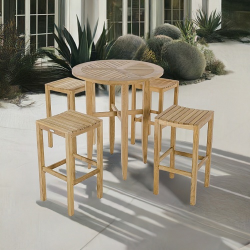 70533 Somerset Laguna 5 piece teak Bar Set of 4 teak backless barstools and round 36 inch diameter bar table on white brick patio with shrubs in background
