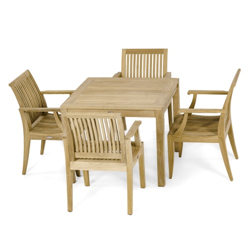 70555 Laguna 5 pc Square Dining Set of Bistro 36 inch Square Teak Dining Table and 4 Laguna Dining Armchairs in angled view on pool deck with pool and fence in the background 