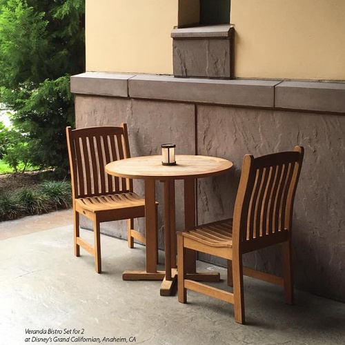 70655 Veranda 3 pc Bistro Set on concrete patio up against outdoor wall at Disney's Grand Californian resort