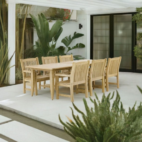 70815 Laguna Veranda 7 piece teak Dining Set of 6 teak dining armchairs and rectangular extendable dining table side angled view on white background