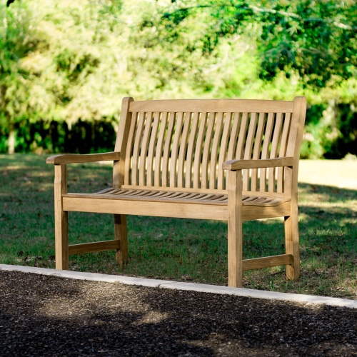 13218 Veranda Teak 4 foot Bench on grass lawn with walkway in front