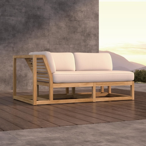 13800DP Maya Right Side Sectional on wood deck against a wall with hillside view in background