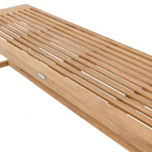 13917 Laguna 6 foot teak Backless Bench on concrete walkway with trees and grass in background 