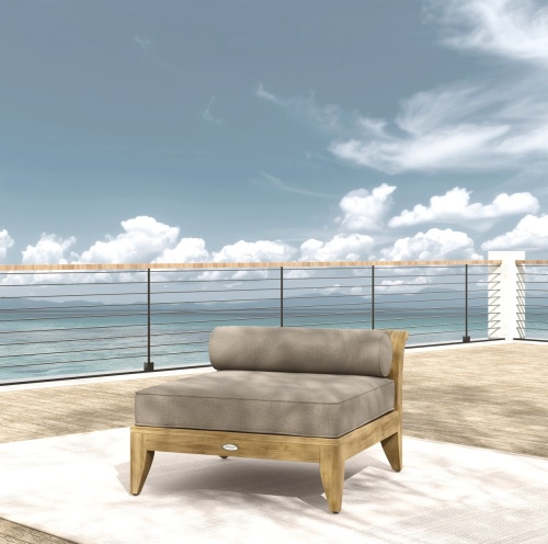 16766DP Aman Dais End Sectional on outdoor wood deck in angled front view with ocean and land in background