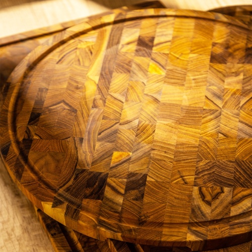 19122 Butcher Block 15 inch Round Charcuterie Cutting Board angled on a table top