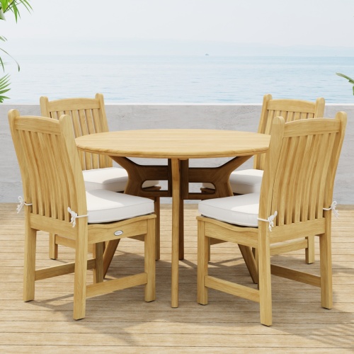 70356 Veranda Surf 5 pc Cafe Dining Set of a Surf 42 inch round dining table and 4 Veranda Side Chairs with optional seat cushions side view on wood deck with ocean background  
