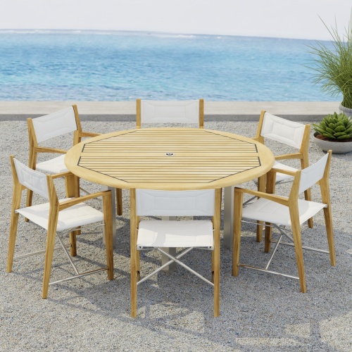 70359  Vogue Odyssey 7 pc Dining Set showing Vogue 5 ft Round Table and 6 Odyssey Chairs on terrace angled side view with 2 potted plants and ocean in the background