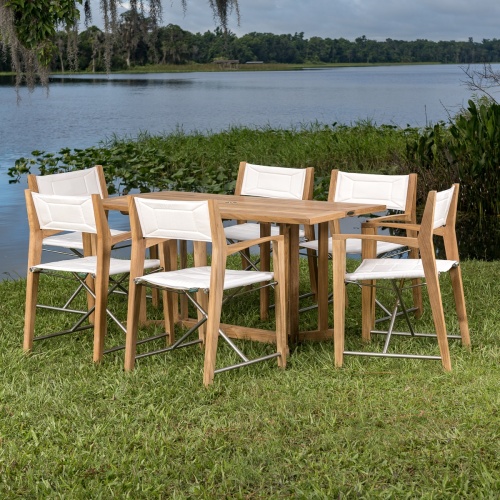 70471 Odyssey Nevis Folding Dining Set on grass field with lake in background
