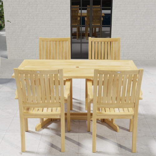 70607 Sussex Nevis 5 pc Dining Set on patio in an angled top view with windows of house in background