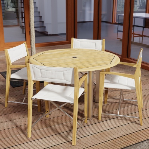 70619 Vogue Odyssey 5 pc Round Dining Set of Vogue Dining Table and 4 Odyssey Folding Chairs angled top view on patio with glass doors in the background 