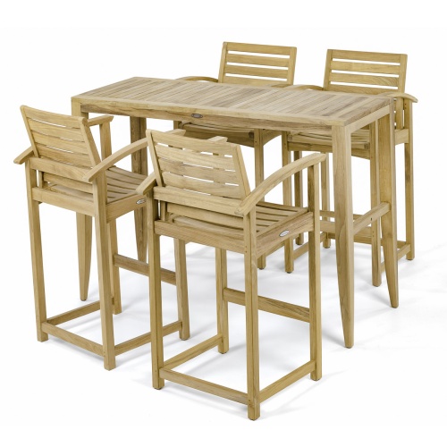 70647 Somerset Laguna Teak Bar Set of Laguna Teak Rectangular Bar Table and 4 Somerset Barstools with arms side angled on a stone patio surrounded by tropical plants and trees in background