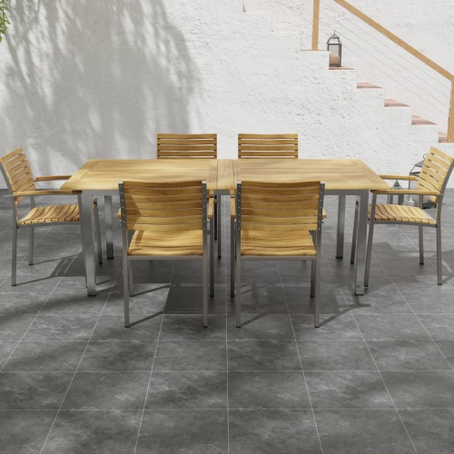 70756 Vogue 7 pc Dining Set with All Armchairs side angled on tiled patio with stairs and potted plant in background