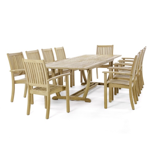 70758 Sussex Veranda 11 piece teak dining set of 10 teak dining armchairs and rectangular dining table end view on white terraced patio with potted and landscaping plants in background