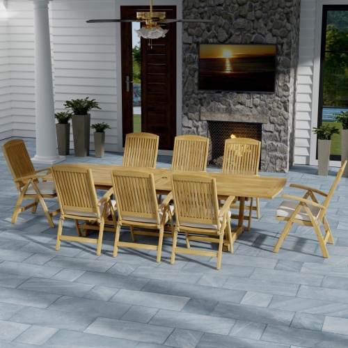 70796 Teak 9 piece Reclining Dining Set in side view on slate tiled patio in front of a fireplace with a door and window of house in background