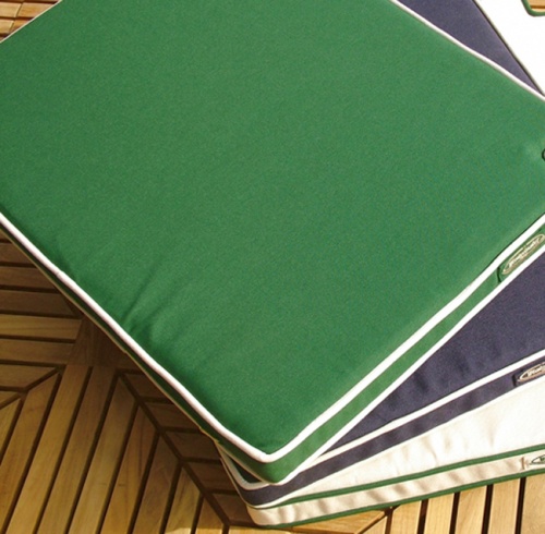 71810CV Laguna Side Chair Seat Cushion stacked 3 high in Natte Wihite and Navy Blue and Forest Green colors in aerial view on teak table 