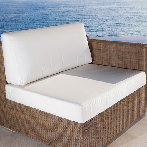 73104MTO Malaga Left Side Sofa Cushion on Malaga left side sofa on concrete deck in front of pool with ocean and blue sky background