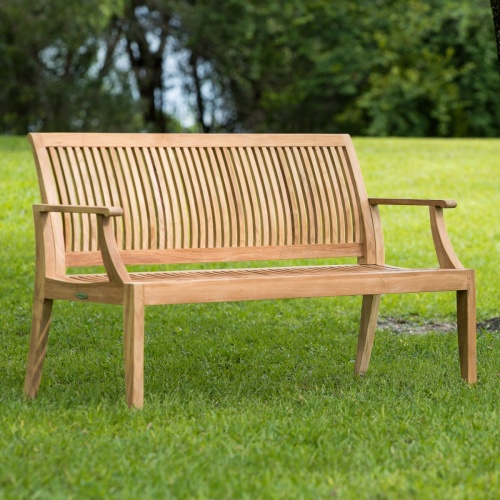 13811 Laguna 5 foot Teak Bench side angled view on brick patio with white potted tree and front of house in background