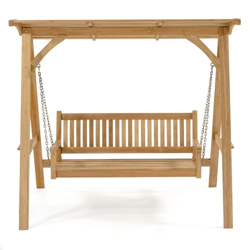 13955 veranda swinging bench and teak canopy with four throw pillows on grass angled with trees and shrubs in background