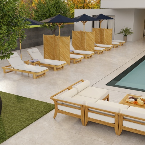 6770DP Horizon teak Chaise Lounger with optional cushion showing 6 in angled aerial view facing pool with building and trees in background