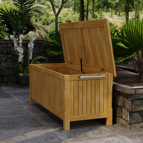 18203 somerset rectangular storage box in angled side view with open lid on deck with landscape plants in background