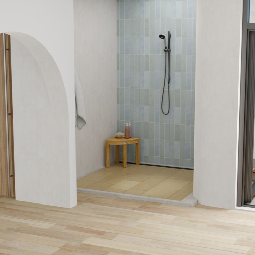 18818 Pacifica Corner Spa Stool in shower showing a loofah and 2 bottles of shampoo on top in a front aerial view