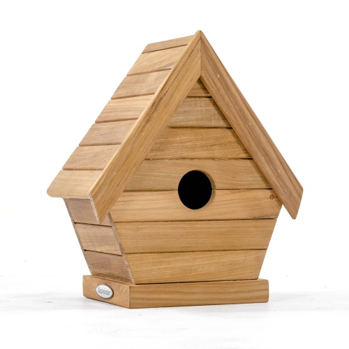 19003 teak bird house on fence post on grass with trees in background