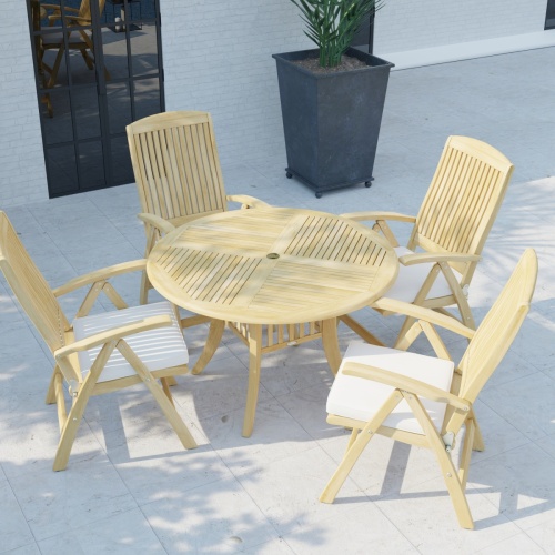 70025 Hyatt Recliner Dining Set with Seat Cushions in angled aerial view on tiled stone patio next to a potted tree with a door of house in background