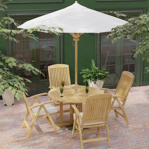  70028 Barbuda Reclining 5 pc Teak Set in angled aerial view with optional seat cushions and umbrella on brick patio with house and landscaping plants in background