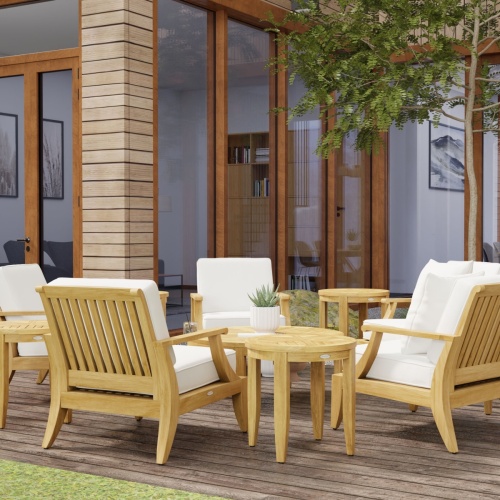 70106 laguna eleven piece lounge set on stone patio with water glasses and books and cheese tray with crackers overlooking trees and mountains in background