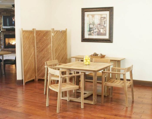 70174 Horizon 5 piece Square Dining Set indoors on wood floor with lemons on table center and teak privacy screen and wall picture in background 