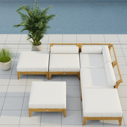  70283 Aman Dais 6 pc Daybed Sectional Set in front view on patio next to potted plant with pool and ocean and hillside view in background