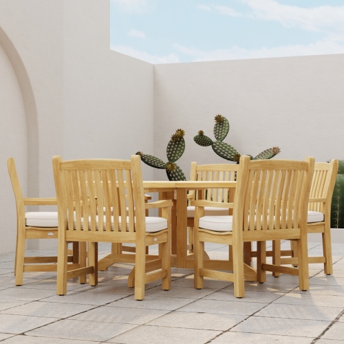 70350 70350 Barbuda Veranda 7 pc Dining Set with optional seat cushions side profile view on stone patio with cactus plants against a privacy wall in the background 