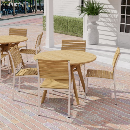 70825 Barbuda Surf 4 piece Dining Set of 4 folding side chairs and round 42 inch dining table in angled aerial view on brick paver patio and french door and potted fern in the background