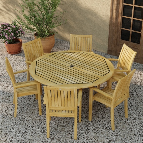 70358 Vogue Sussex 7 pc Dining Set of Vogue 60 inch Round Table and 6 Sussex Armchairs in aerial top view on patio with 2 potted plants next to a french door in background