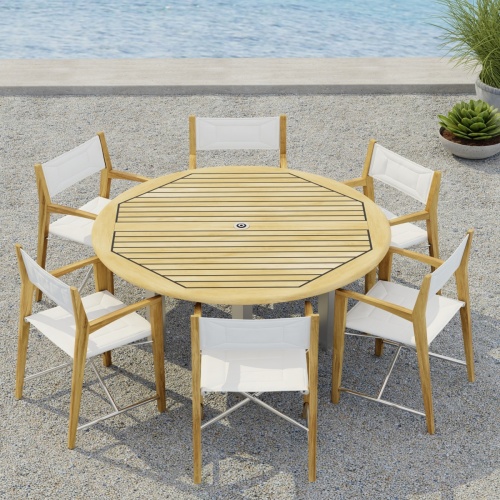 70359  Vogue Odyssey 7 pc Dining Set showing Vogue 5 ft Round Table and 6 Odyssey Chairs on terrace angled aerial view with 2 potted plants and ocean in the background