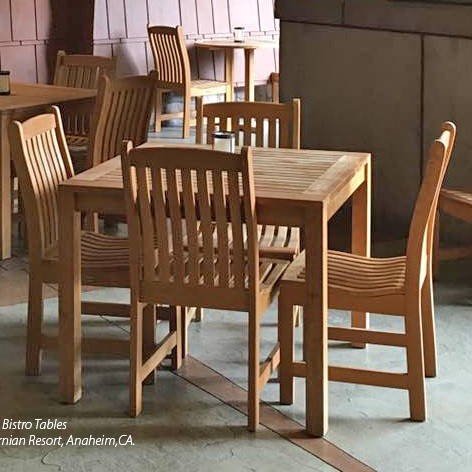 70424 Veranda teak 5 piece square Bistro Set of 4 teak side chairs and 36 inch square dining table on concrete patio with pool in background