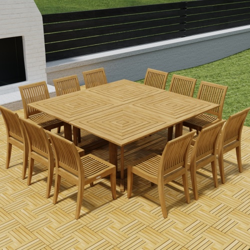 70435  Pyramid 14 pc Teak Dining Set on Teak Parquet floor deck angled top view in front of an outdoor fireplace with privacy wall and green lawn in background