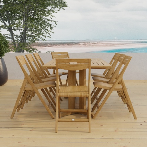 70464 Surf Pyramid Teak Dining Set for 8 angled side view on outdoor terrace with the ocean and sky in the background 