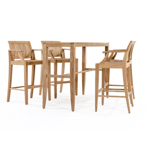 70501 Laguna 5pc teak Bar Set with plate and candle on pavers next to pool with fireplace two craftsman chairs two potted flowering plants and shrubs in background 