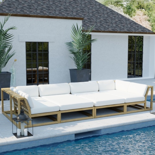 70515 Maya Teak 4 pc Daybed Set of Maya Left and Right Sectionals and 2 Chaises on patio in angled aerial view with a pool in front of set and 2 potted plants and house in background