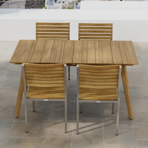 70552 Vogue Surf 5 pc Dining Set of Surf Table and 4 Vogue Side Chairs on an outdoor terrace in angled side view with homes in background