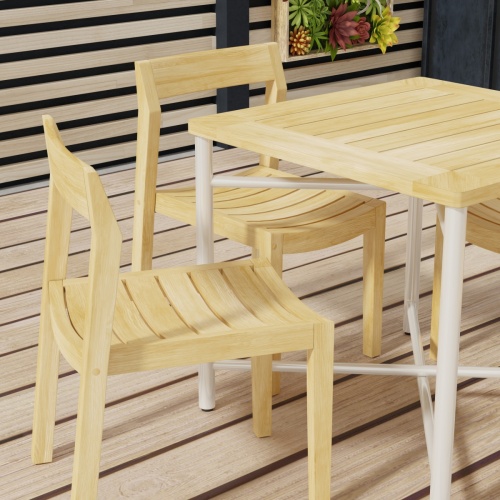 70596 Odyssey Horizon Teak and 316L Stainless Steel Dining Set in partial angled corner view on wood deck with privacy wall with succulents in the background