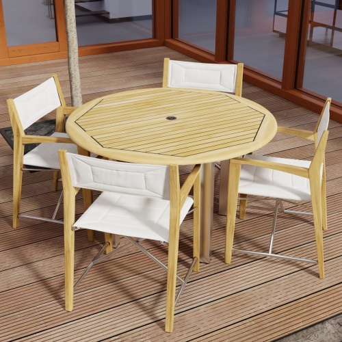 70619 Vogue Odyssey 5 pc Round Dining Set of Vogue Dining Table and 4 Odyssey Folding Chairs angled aerial view on patio with glass doors in the background 