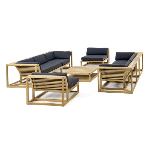 70753 Maya 7 pc Twin Sofa Set in angled view on pool deck next to a pool with a potted plant and lantern and house in the background