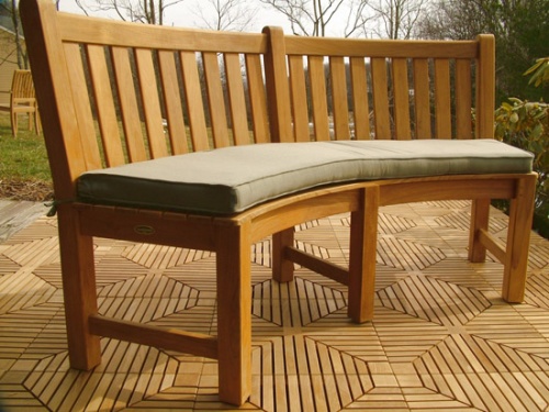Image of 73852MTO Stone Green color cushion for Buckingham Curved Bench on teak tiles with trees in background