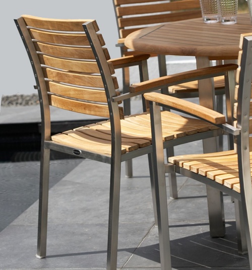 22007ST Vogue Dining Chair closeup of back side of armchair on concrete patio