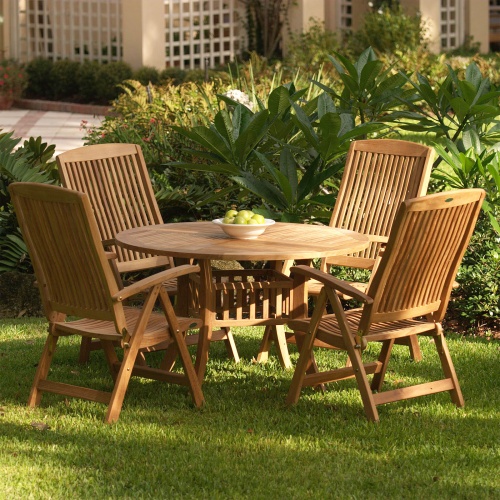 70025 Hyatt Recliner Dining Set showing white bowl of green apples on grass yard with shrubs 4 white lattice panels and house in background