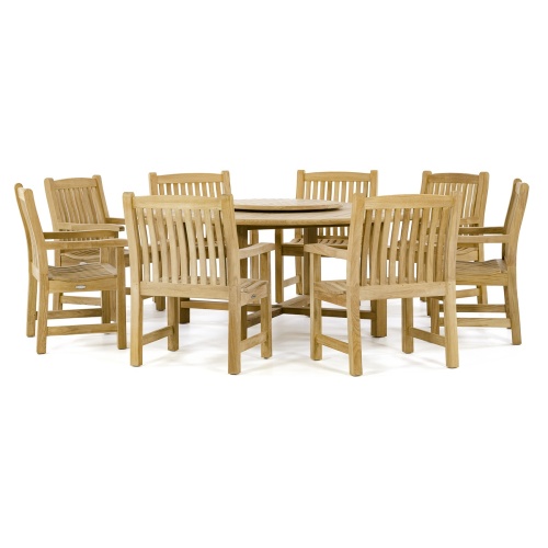 70173 Buckingham 9 pc teak Dining Set of 8 dining armchairs and 6 foot round dining table on grass field with flowers trees and house in background