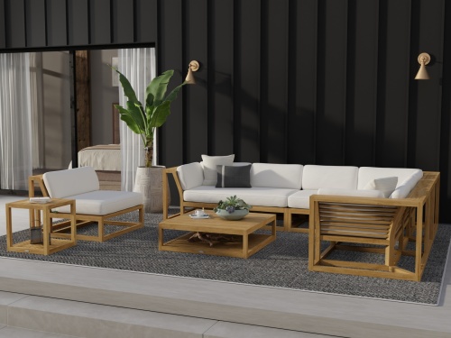 70230 Maya deep seating collection with canvas cushions four throw pillows bowl of green apples a potted succulent magazine on tables on a concrete patio with palm trees and ocean views in background